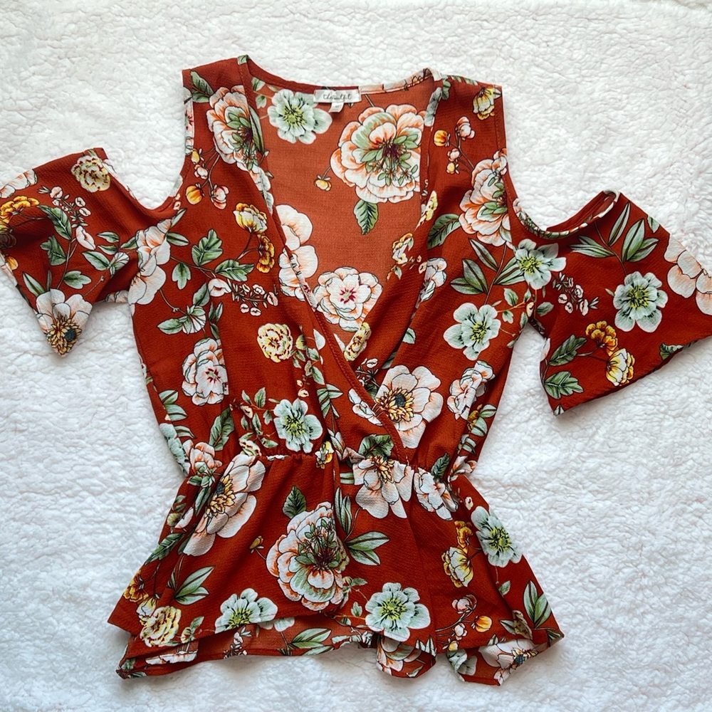 Blouse perfect for fall. Floral design. Shows off shoulders. Peplum style. Rust.